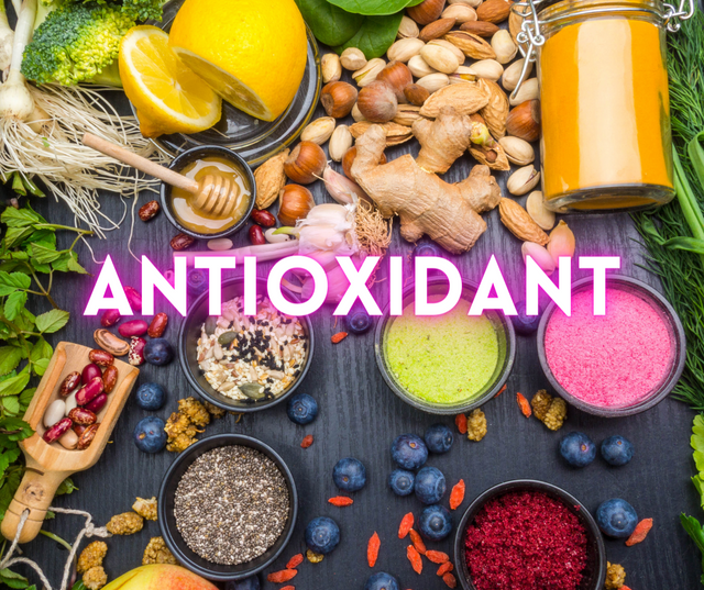 Flat lay of antioxidant-rich foods, nuts, berries and seeds with the word ANTIOXIDANT