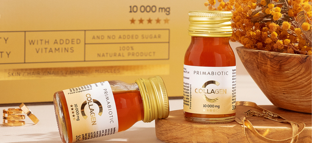 Two Primabiotic Collagen bottles on a wooden table with dried flowers