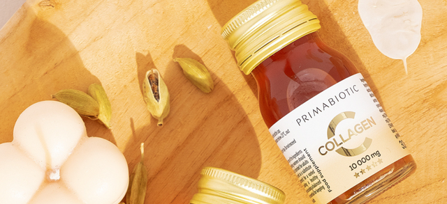 Primabiotic Collagen bottle on a wooden board with seeds and shells