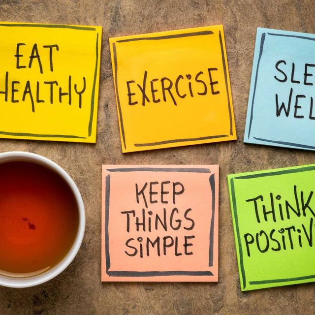 Sticky notes reading Eat Healthy, Exercise, Sleep Well, Keep Things Simple and Think Positive